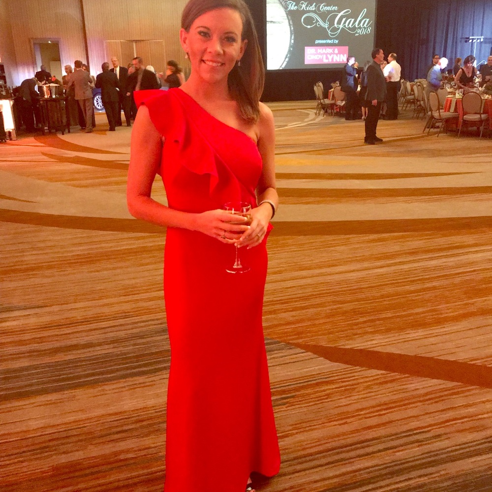 Red one shoulder evening gown